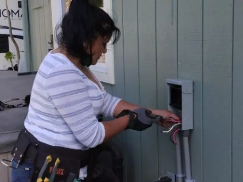 Licensed electrician wiring an exterior subpanel in Walkertown